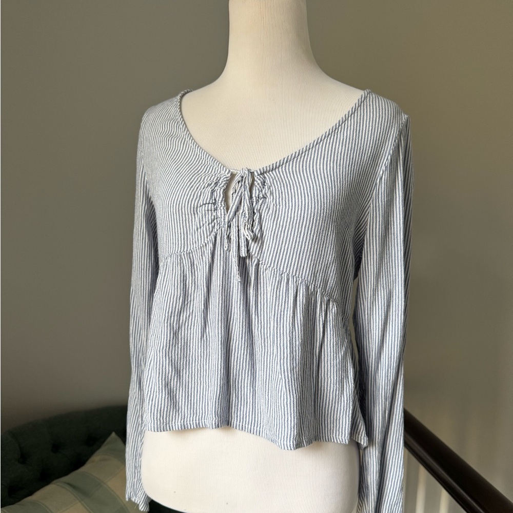Hollister Blue and white striped long sleeve top with tie front detail 
Size XS